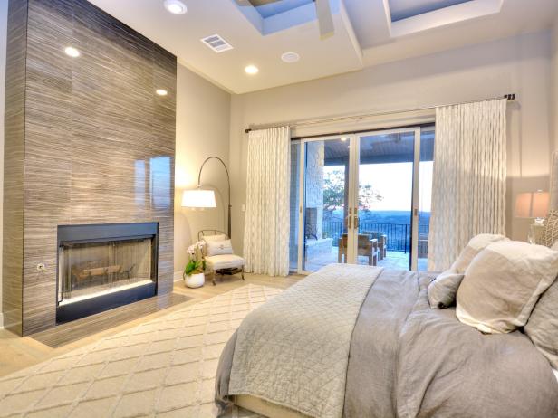 Luxurious Master Bedroom With Polished Stone Fireplace