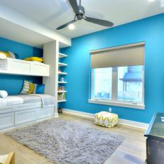 Bright Blue Kid's Room With Built-In Bunk Beds and Gray Shag Rug 