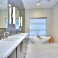 Stylish, Contemporary Bathroom With Gray Stone Accent Wall & Marble Floor 