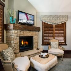 Cozy Master Sitting Area Features Stone Fireplace
