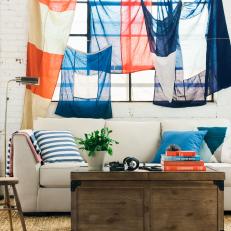 Hanging Vintage Flags Above Living Room Sofa