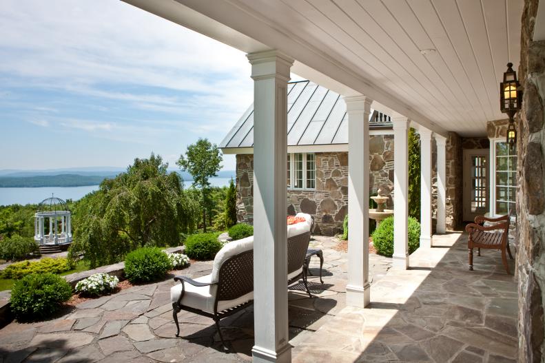 Traditional Flagstone Porch With White Columns
