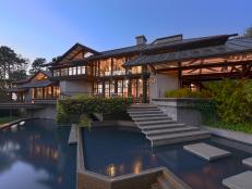 Exterior of Glass & Timber Home With Modern Water Feature