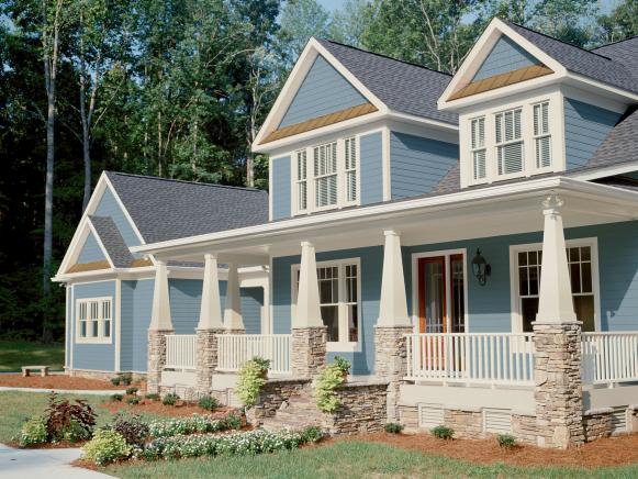 Blue Craftsman-Style Home With White Trim