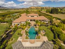 Aerial View of Italian-Style Home With Swimming Pool