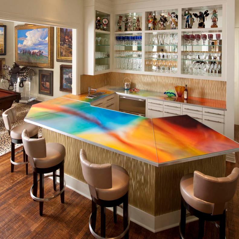 Bar With Multicolor Countertop, White Cabinets & Gold Backsplash
