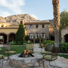 Mediterranean Patio Boasts Stone Fire Pit and Stunning Views 