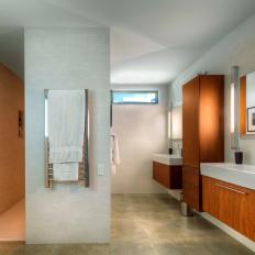 Soothing Contemporary Bathroom Features Floating Vanities & Storage