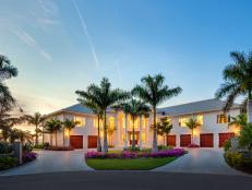 White Beach House Exterior With Palm Trees & Six Bay Garage