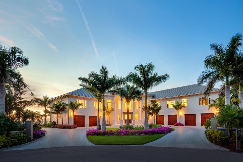 White Beach House Exterior With Palm Trees & Six Bay Garage