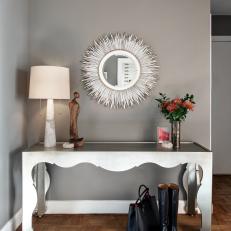 Quill Mirror Above Metallic Console Table