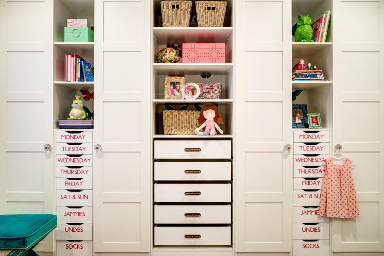 Girl's White Closet With Built-In Drawers and Shelves