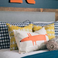 Mixed Decorative Pillows and Gray Upholstered Headboard