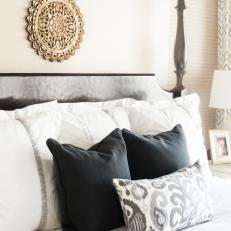 Black, White and Ikat Accent Pillows on Bed