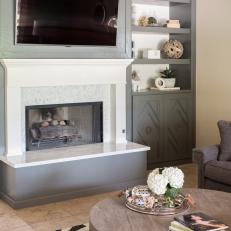 Gray and White Fireplace With Built-In Shelves