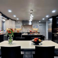 Contemporary Kitchen Features Black and White Cabinets