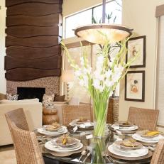 Contemporary Dining Room With Tall Floral Centerpiece