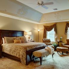 Beautiful Traditional Master Bedroom Framed in Golden Hues