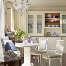 White Eat-In Kitchen With Elegant Blue Accents