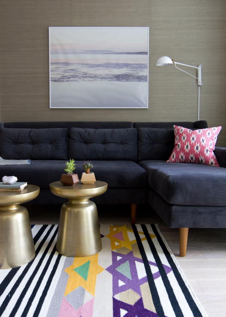 Neutral Living Room With Navy Sectional, Gold Tables