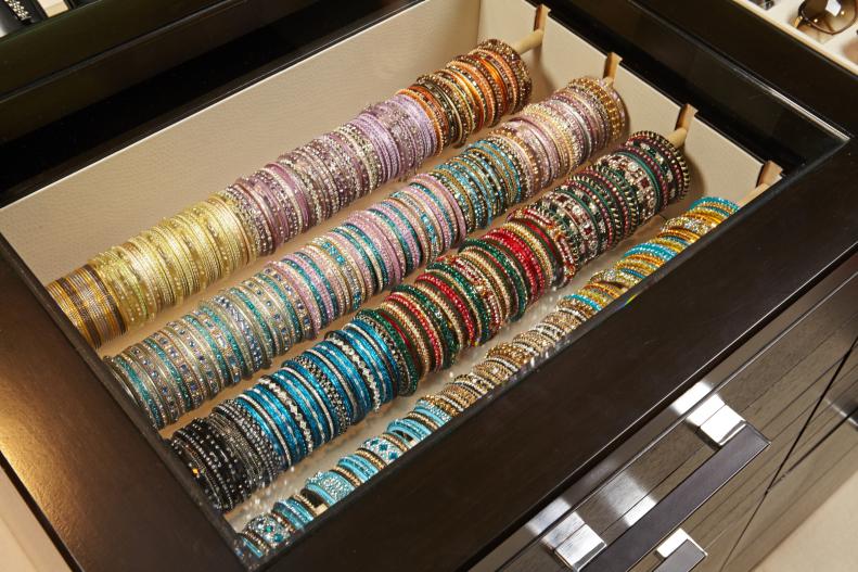 Open Drawer With Colorful Bracelets on Rods
