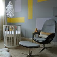 Contemporary Gray Nursery With Oval Crib