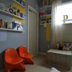 Contemporary Nursery in Gray With Display Shelves for Books
