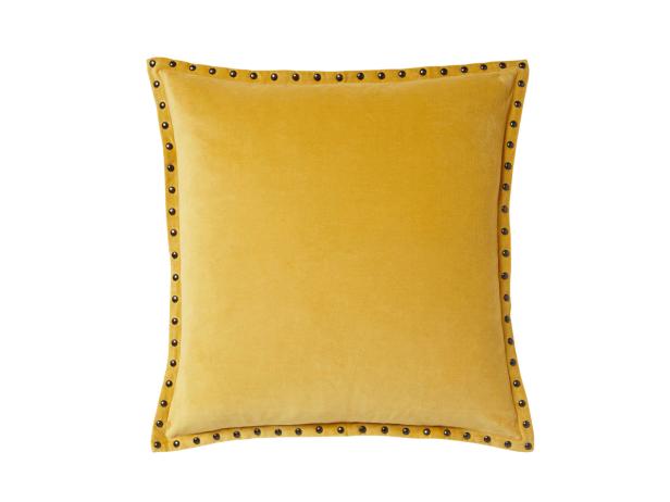 This yellow pillow has texture with velvet and studs