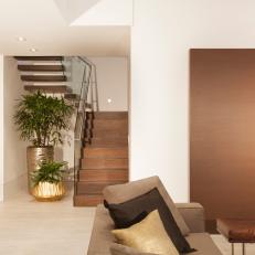 Chic Modern Staircase Flows To The Main Living Space