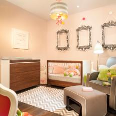 Contemporary Nursery Features Wood Changing Table, Crib & Chevron Rug