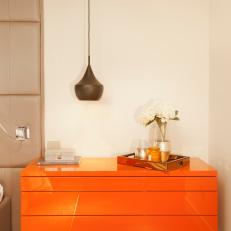 Orange Lacquered Cabinet With Beat Pendant Light