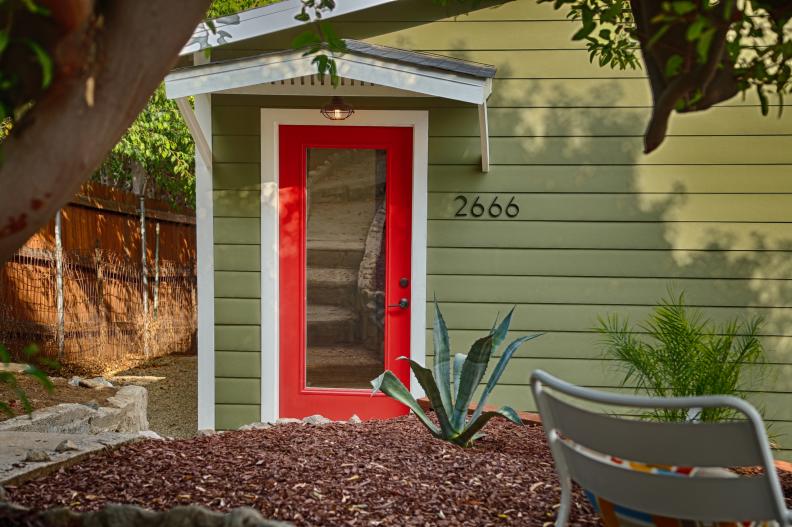 Small Green Exterior With Red Front Door