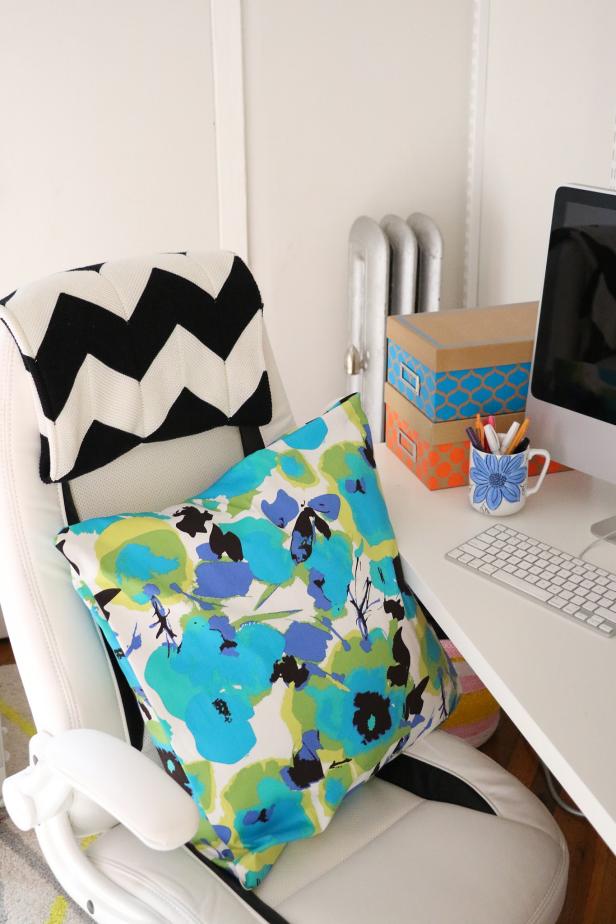 Use this bold and colorful pillow to add some summer style to your office space.