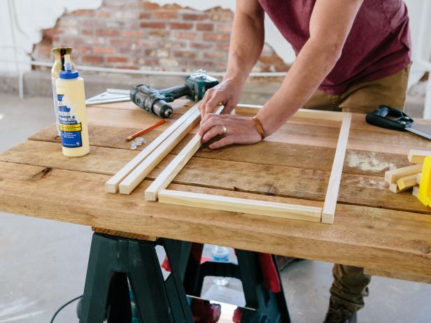 Create a table base by forming a rectangle and square with square dowels.