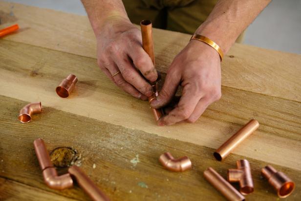 Shape a base out of copper piping to make a one-of-a-kind candelabra.