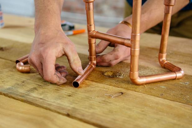 Dry fit copper piping pieces to make a one-of-a-kind candelabra.