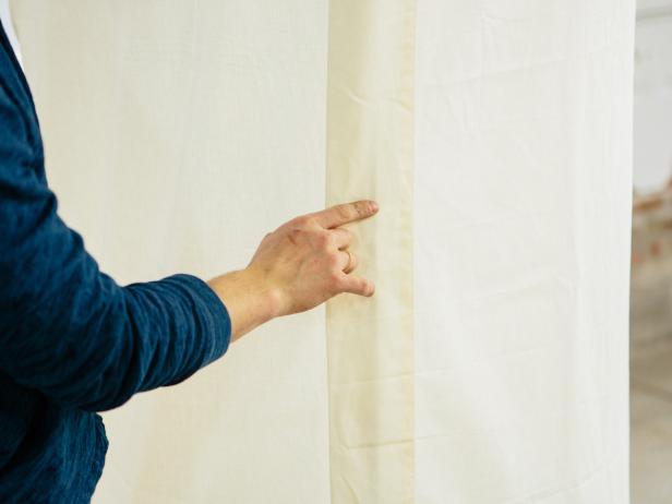 Hide the fabric seam by attaching it to the vertical 4’ piece using double-sided tape.