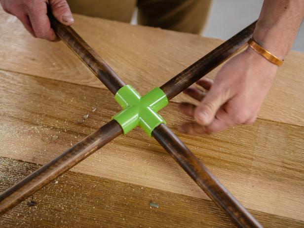 Insert wood dowels to PVC piping to make a coffee table.