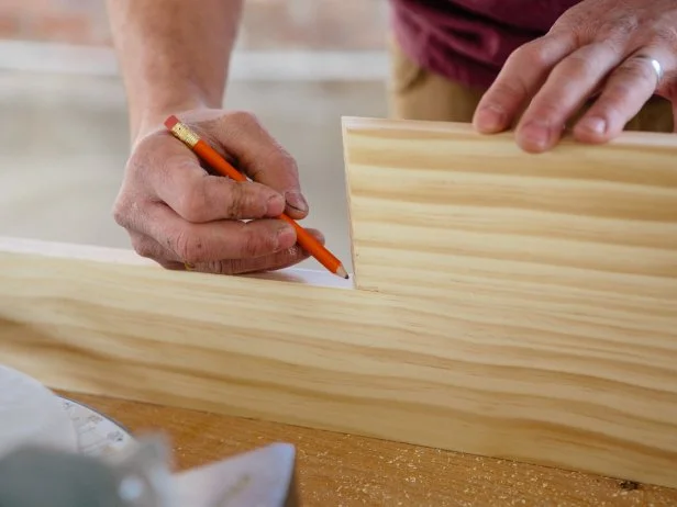 Measure the length you want the sides of the triangle shelf, and mark with a pencil.