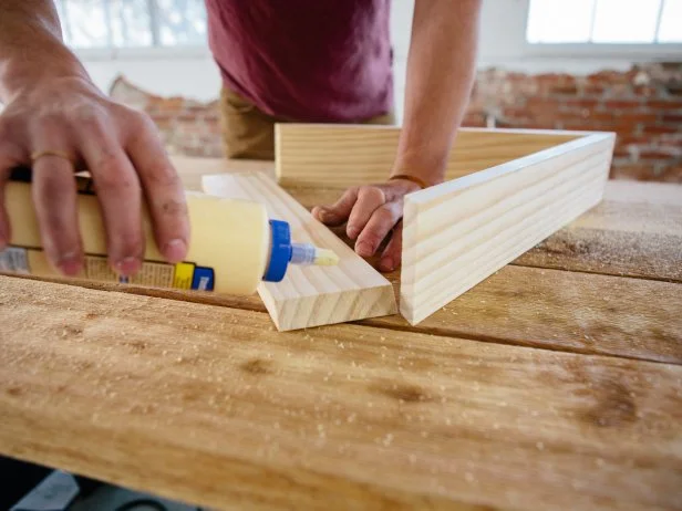Apply wood glue to shelf pieces to adhere them together.