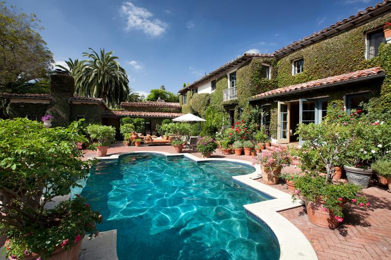 Custom Swimming Pool Surrounded by Lush Garden 