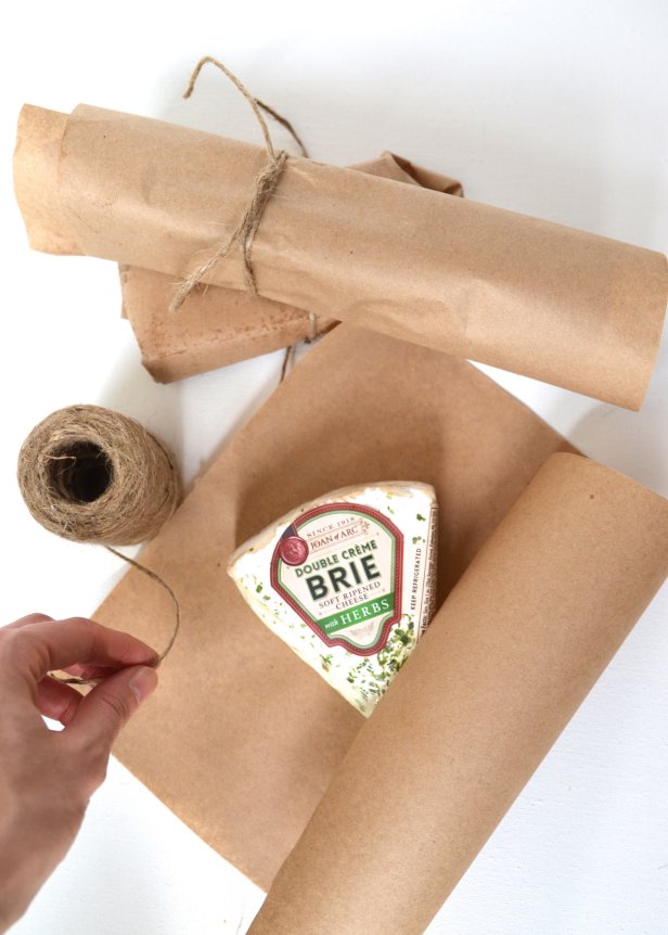 Make a cute gift for the cheese lover in your life by using chalkboard labels and kraft paper to wrap a variety of cheeses.