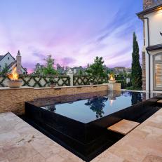 Neutral Stone Patio With Contemporary Infinity Pool