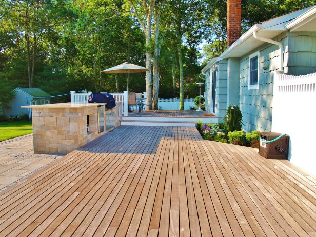 Wood Deck With Stone Outdoor Kitchen, Raised Dining Area 