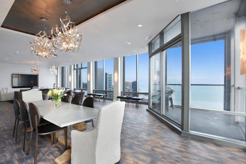 White Contemporary Dining Room With Large Windows & City View