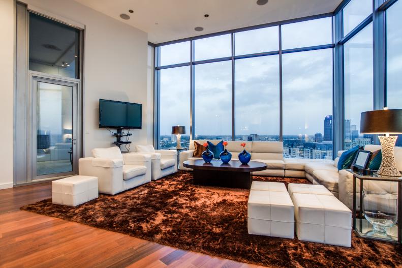 Modern Living Room With Windows, Brown Shag Rug & White Furniture