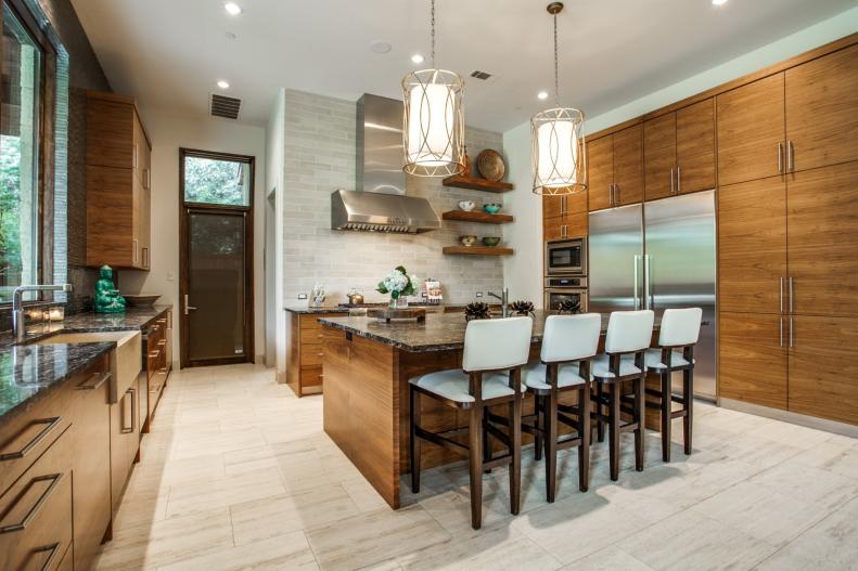 Contemporary Kitchen With Walnut Cabinets and Island With Barstools