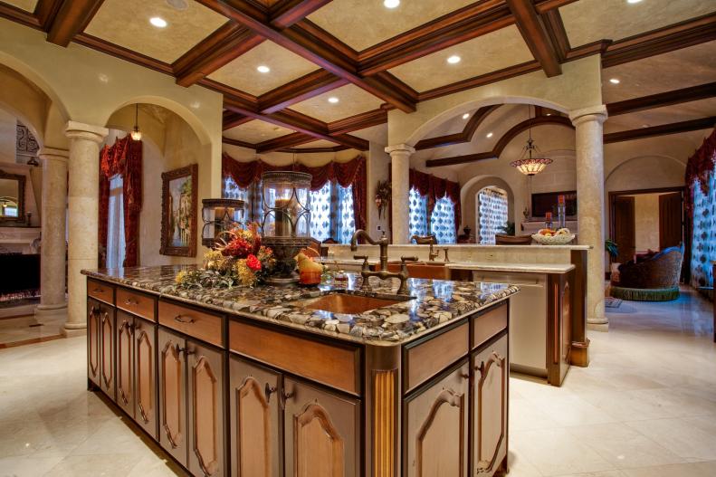 Mediterranean Chef's Kitchen With Coffered Ceiling and Large Island