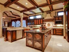 Mediterranean Neutral Kitchen With Brown Cabinets & Coffered Ceiling