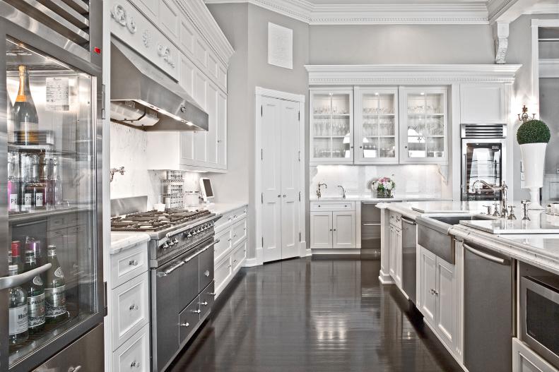 Light Gray Kitchen With White Cabinets and Stainless Steel Appliances